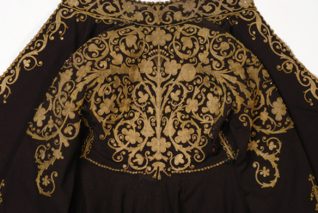 Detail of terzidikos (gold tailored) embroidery at the bottom of the overcoat, in the centre: big stylized vegetal motifs