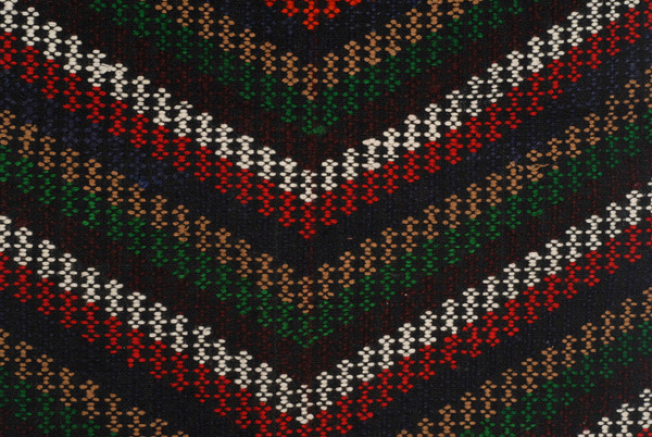 Detail of embroidered decoration, with converging stripes. 