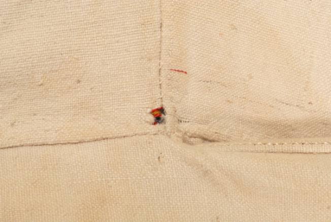 Tiny embroidery under the left armpit