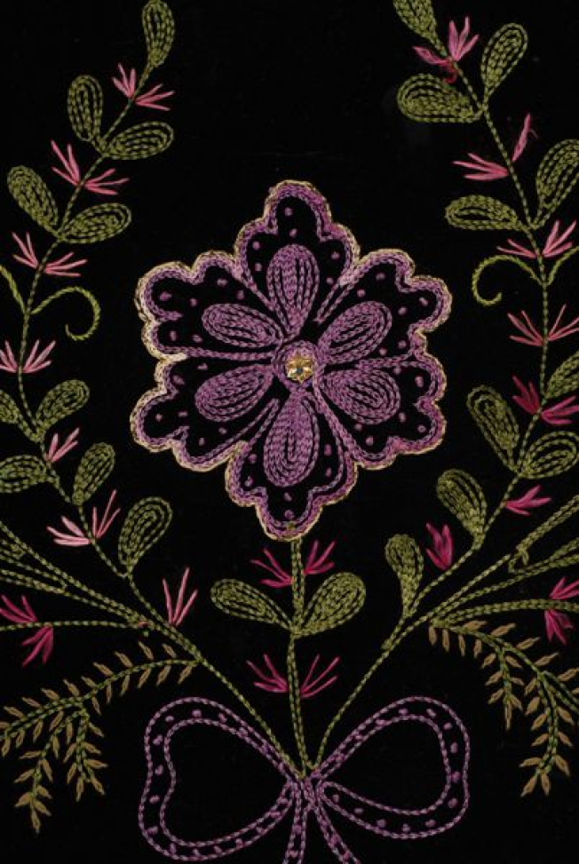 Detail of the embroidered decoration with kassinaki (chain stitch) and riza (stem stitch)