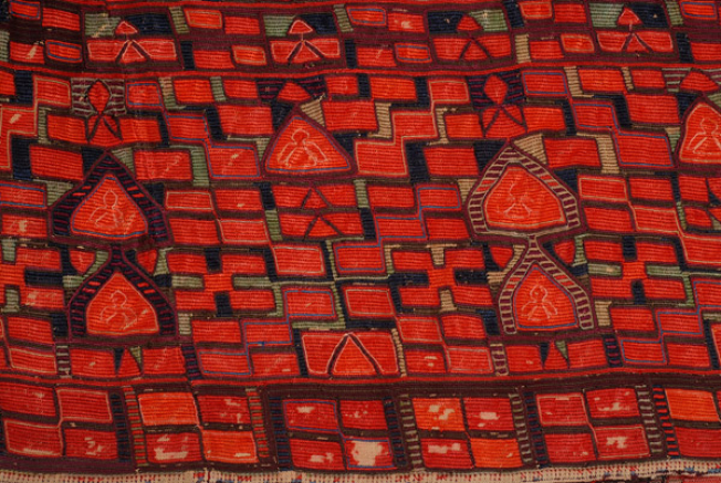 Detail of the embroidery: the three bottom bands. At the centre "double mastrapas (pitcher)".