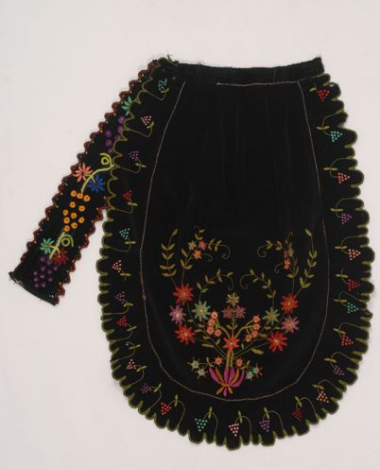 Black velvet apron embroidered with colourful silk