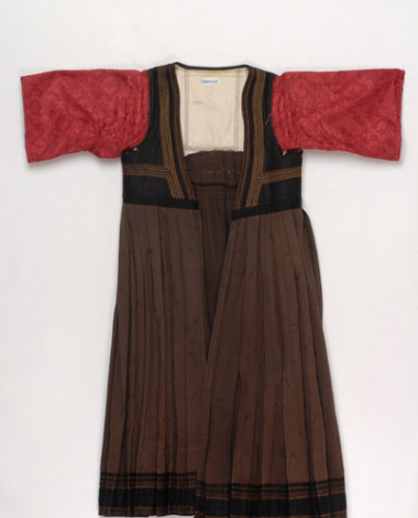 Foustani (dress) made of brown cotton fabric, ornamented with karelisia embroideries (multicoloured stitches)