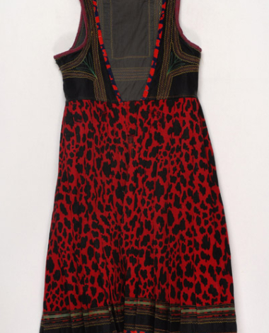Foustani (dress) made of crimson woollen flannel in red and black animal print, ornamented with karelisia embroideries (multicoloured stitches)