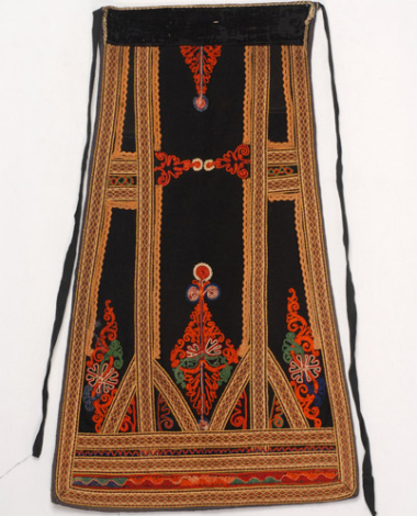Karagounian outradenia apron made of black felt, ornamented with woven bought bands and zig-zag braids 