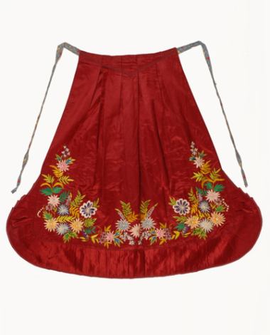 Festive apron made of red satin fabric with multicoloured silk decoration