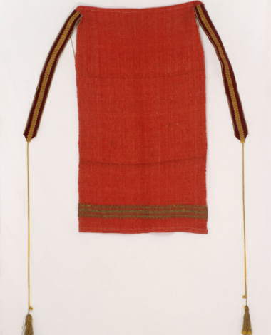 Handwomen tile-red wool apron. The applique decoration with the gold fillet is a later addition