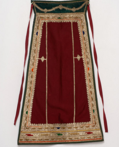 Karagounian apron made of crimson felt, embroidered with white and gold cordon along with a few coloured outres (silk braids)