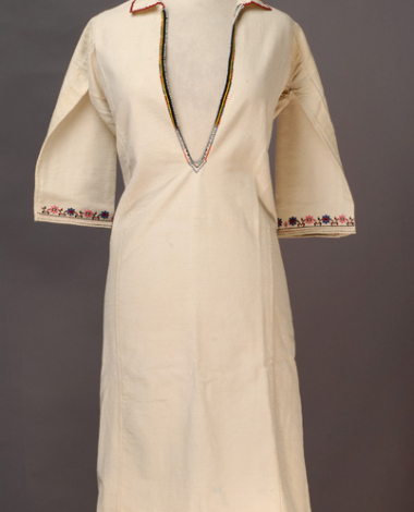 White cotton woven chemise, embroidered with woollen and cotton coloured threads
