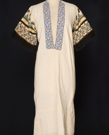 Chemise of white cotton cloth with white embroideries at the border and sleeves with dark coloured decoration