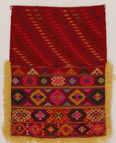 Wool tagarissia apron with loom embroidery