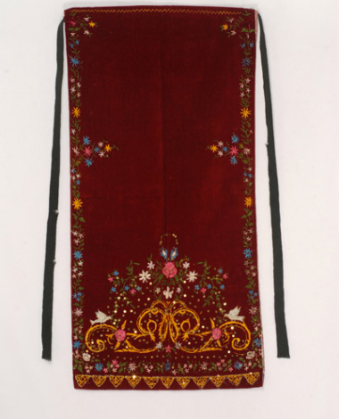 Single panel velvet apron of a later type with colourful silk embroidery