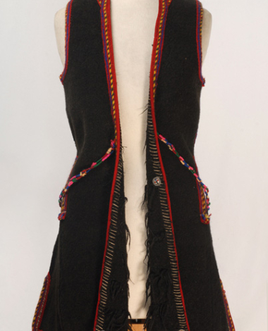 Woollen sigouna, sleeveless overcoat made of saddle blanket decorated with colourful seradia, silver cordons, coins and buttons