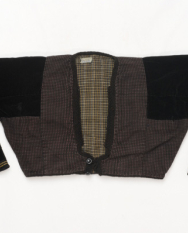Zipouni or midani, sleeved short jacket made of dark coloured woven fabric 