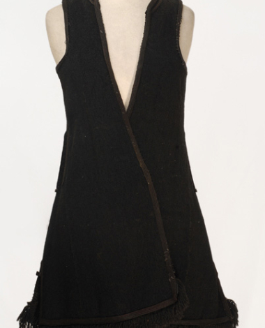 Kiourdia, sleeveless outer overcoat made of black horse cloth, ornamented with plain coloured cordons and woollen fringes
