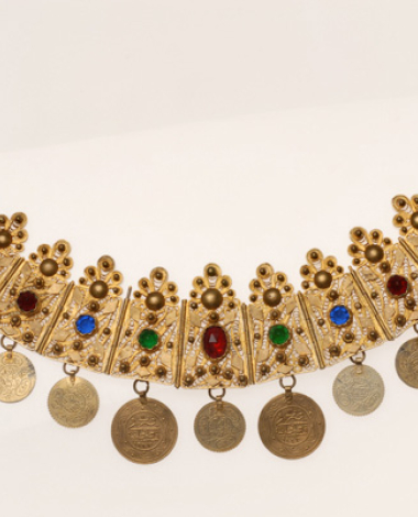 Gilt xelitsi, filigree head ornament decorated with variegated glass stones and gilded coin imitations