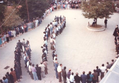 The "kykles" circle dance at Houliarades Ioanninon in September 1991. (Photo printed in the publication Improvisation in Greek Folk Dancing, Lefteris Drandakis, 1993)