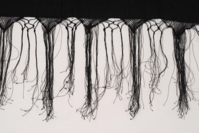 Detail of the decoration, netting with fringed end