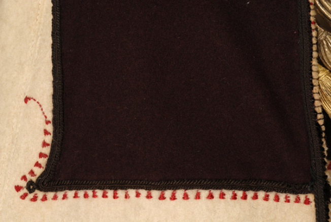Embroidery under the applique felt