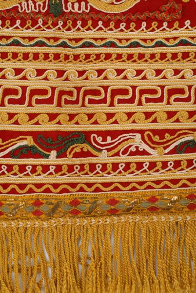 Lower part of the apron, detail of the band-like geometric decoration with colourful silk