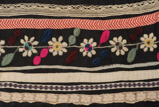 Embroidery framed by applique decoration