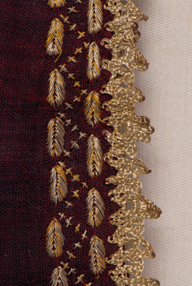 Sleeve, detail of the decorative motif and the lace