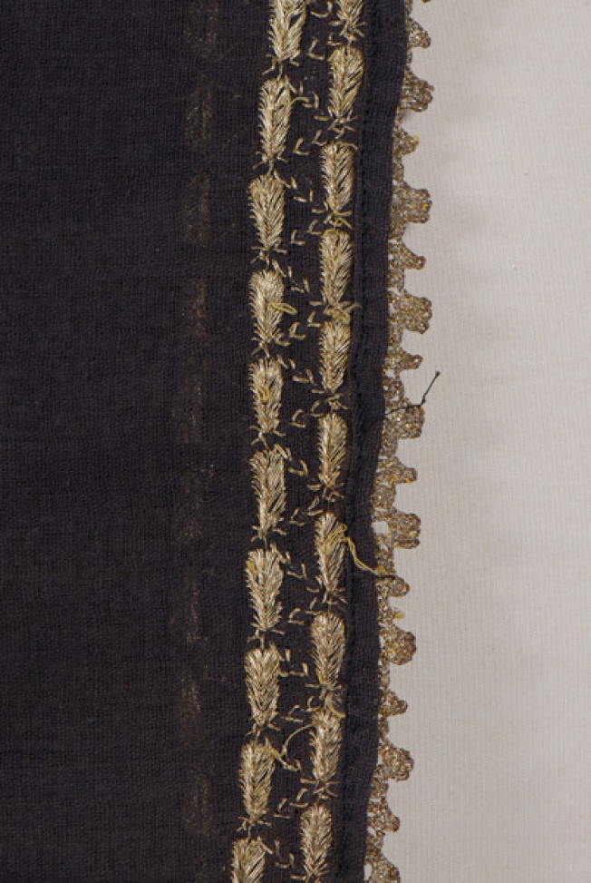 Sleeve, detail of the decoration of the hem and the edging