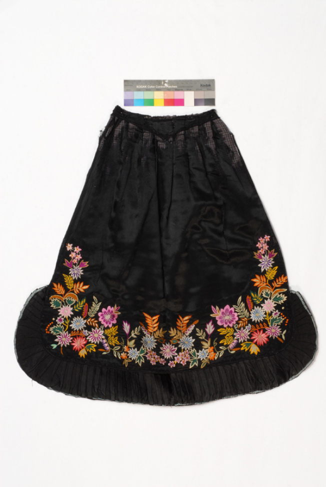 Black satin apron embroidered with multicoloured silk threads