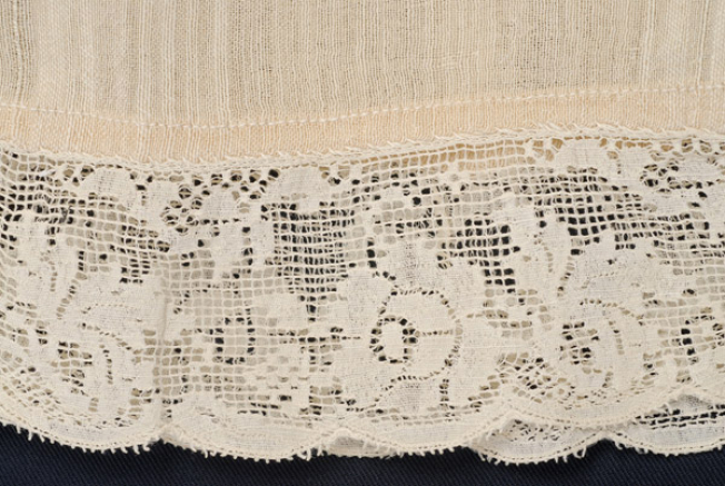Sleeve, detail: striped, curly fabric and lace