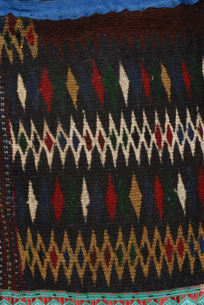 Bottom part of the apron, detail of the embellished decoration with woollen threads, golden threads and silver threads
