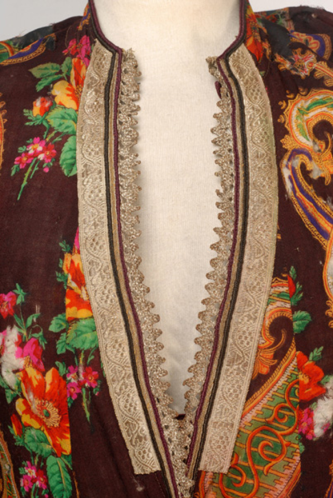 Detail of the decoration at the chest, silver fillet and lace with silver thread