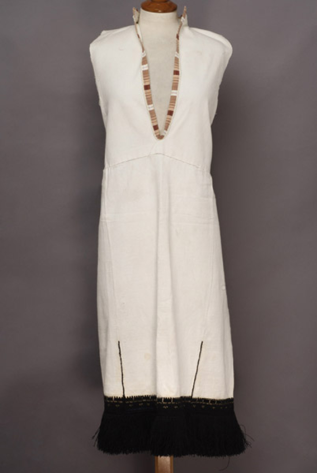 White cotton sleeveless chemise, embroidered with black woollen threads