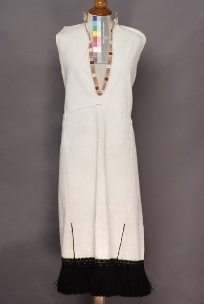 White cotton sleeveless chemise, embroidered with black woollen threads
