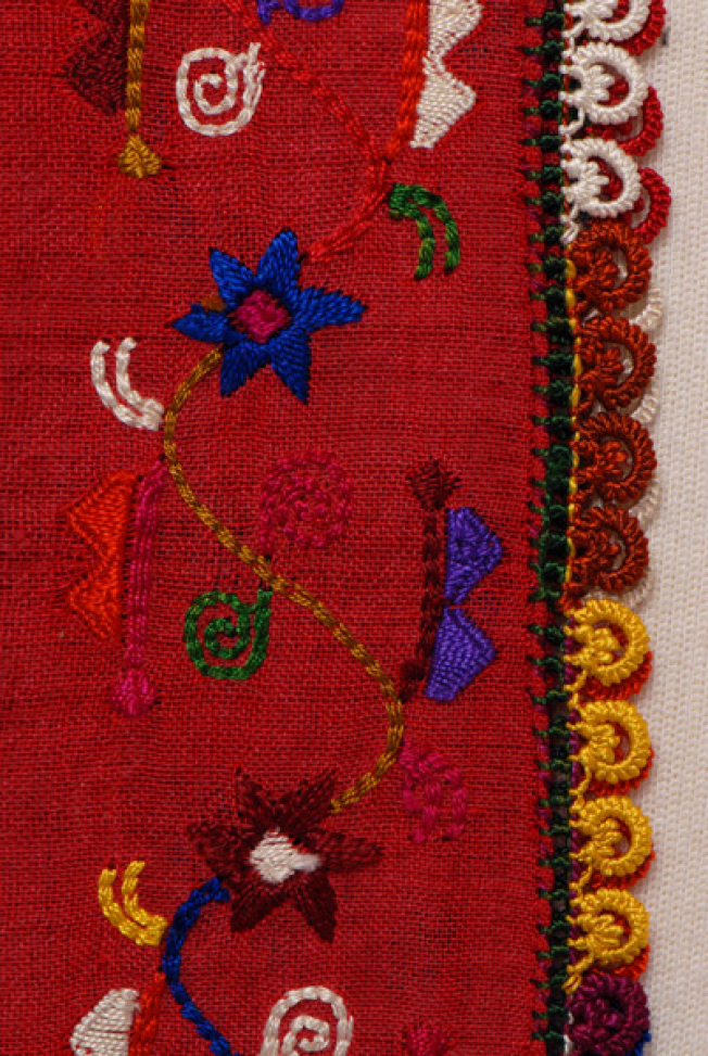 Sleeve, detail of the decorative motif and the lace
