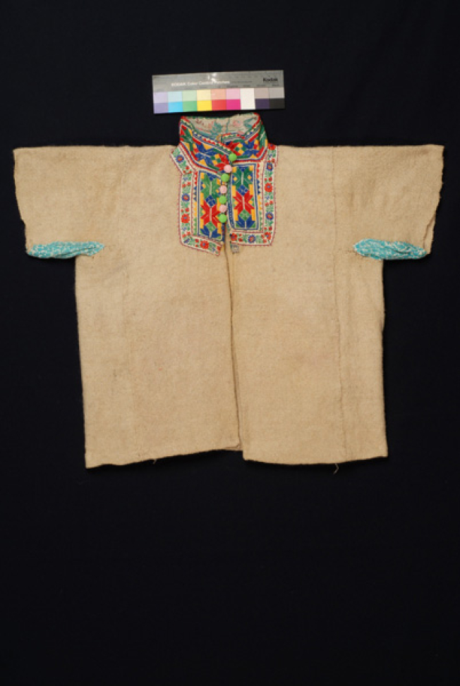 Mallina, woollen flannel made of white woven ornamented with machine fillets and applique pieces with multicoloured geometrical patterns