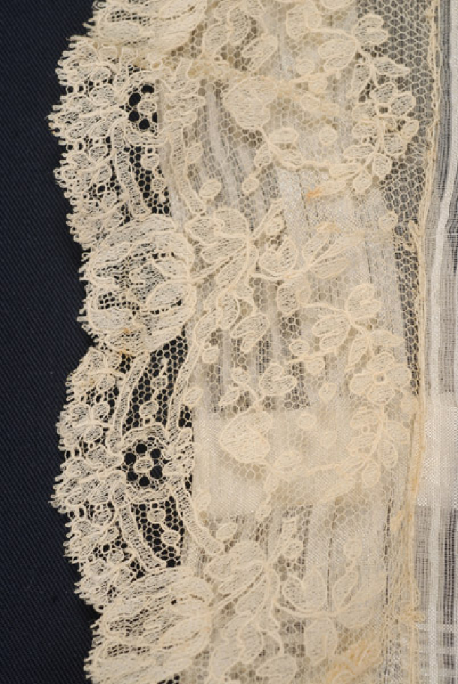 The decorative lace of the pillowcase