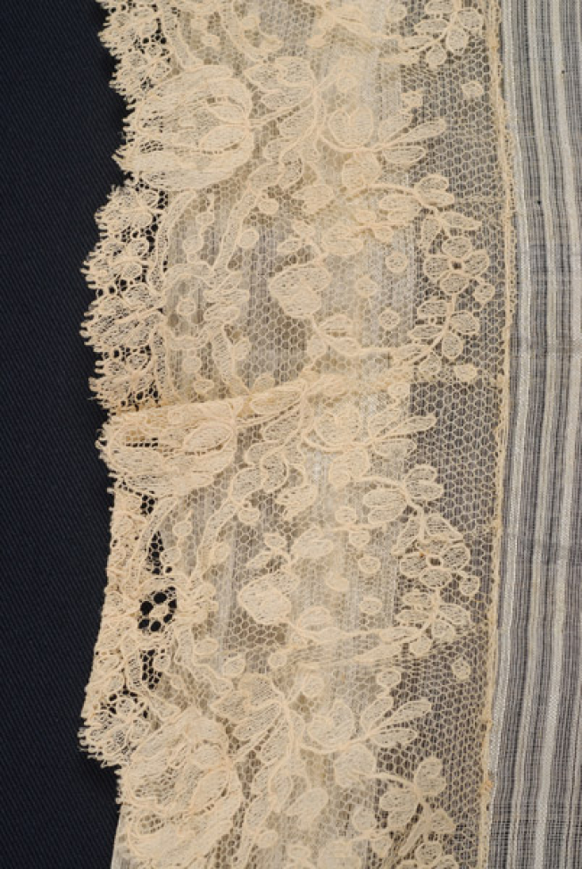 The decorative lace of the pillowcase