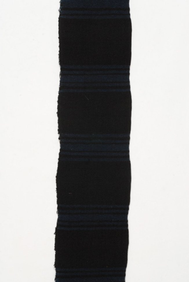 Detail of the embellished peacock-blue bands in the centre of the sash