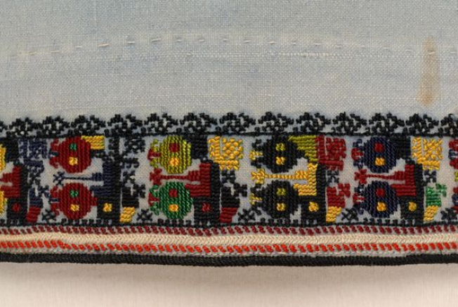Detail of the embroidered decoration at podia, border