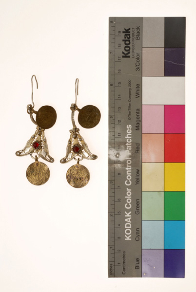 Pair of wiry gold plated earrings ornamented with red glass stone and gilded coins