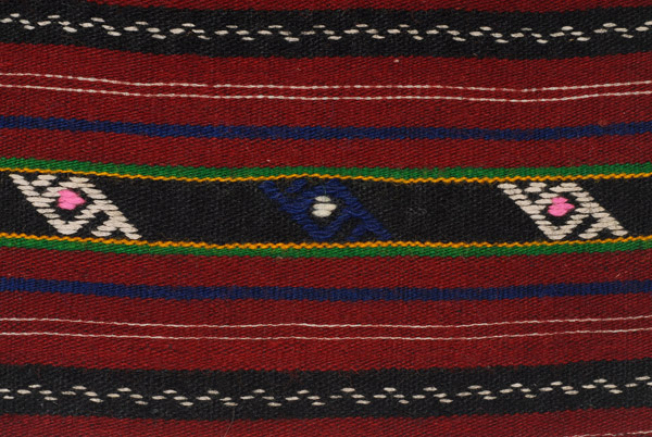 Detail of the decoration, embroidered side parallelograms at the embellished stripes
