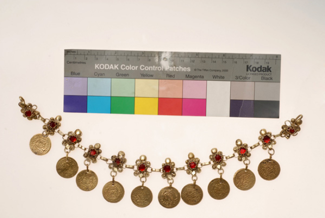 Flouria me goubedes, chain with flower-shaped wiry plates with a red stone. Head ornament, accessory of the karagounian headdress with bereta 