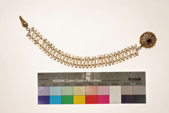 Kefalokobtsa, chained head ornament with a wiry rosette, decorated with red glass stone
