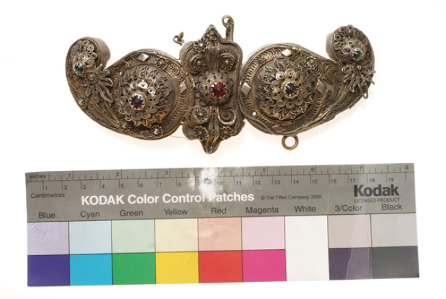 Gilded buckle with wiry multi-leafed rosettes and coloured glass stones 