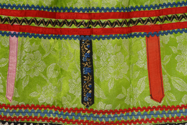 Detail of embellished decoration at the border, braids and ribbons 