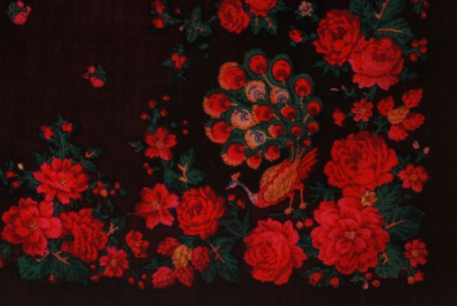 Detail of the printed decoration, edging surrounding a peacock at the corner