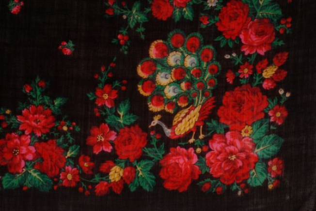 Detail of the printed decoration, edging surrounding a peacock at the corner