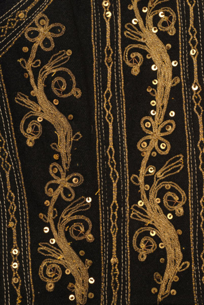 Side panel, detail of the gold embroidered vegetal decoration, trimmed with spangles fastened with tir-tir (lustring)