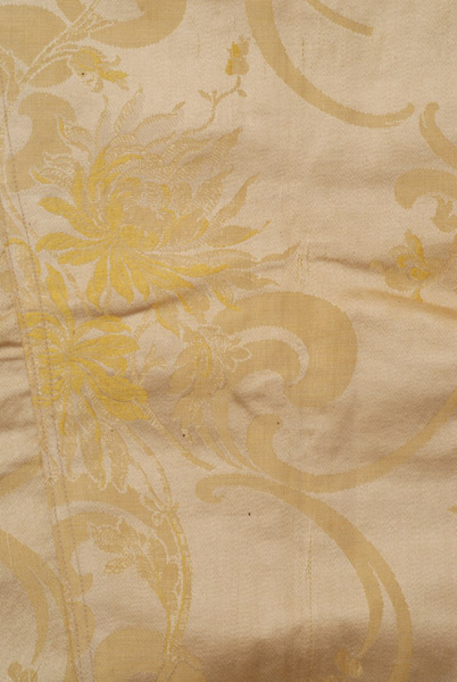 Detail of the embellished decoration on the silk brocaded fabric