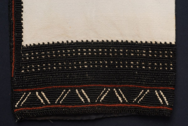 Sleeve, detail of the decoration. Embroidery with trichoutsikous at a total black gazisio chemise
